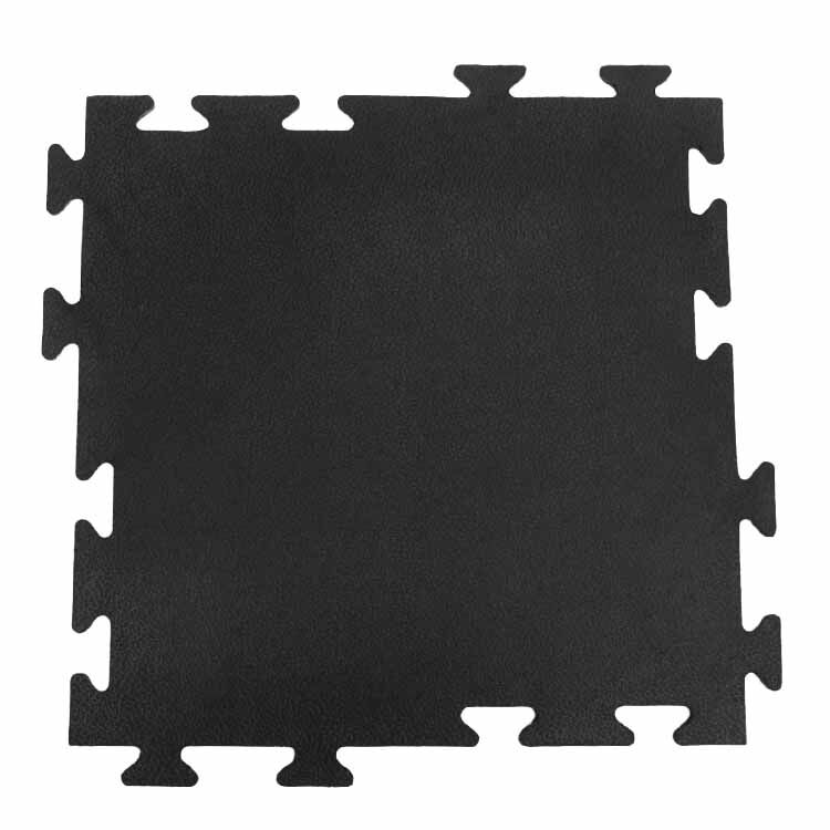 Top View of Black Interlocking Rubber Fitness Tile on White Background