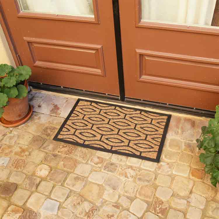 Green Terrace Rubber Back Door Mat in Front of Brown Double Doors