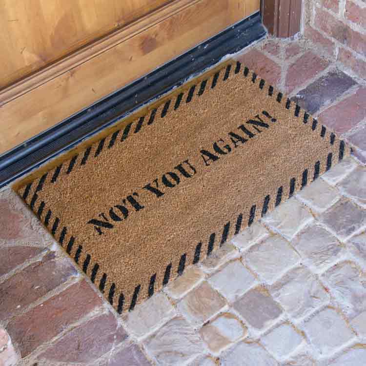 Coir Doormat with Not You Again! Design at Door Entrance