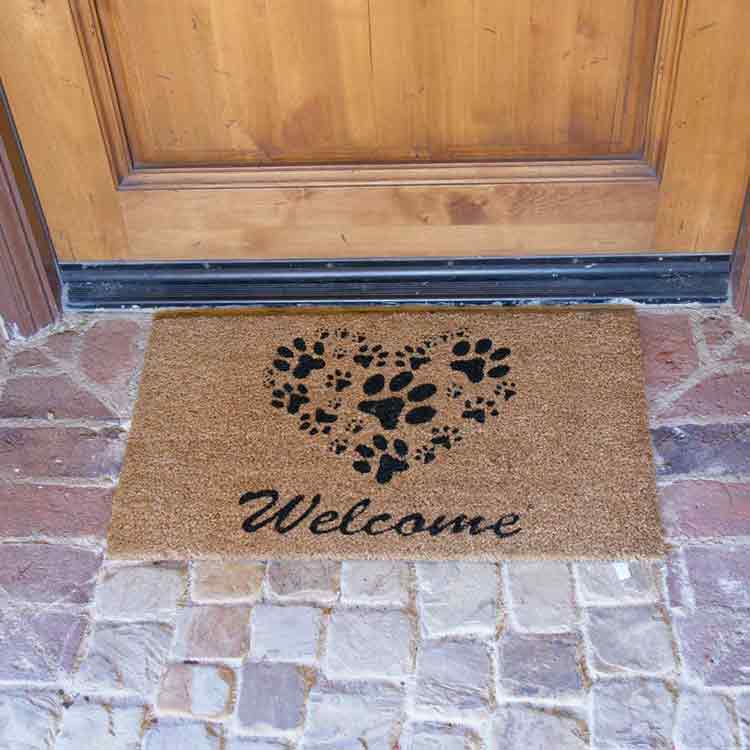 Heart Shaped Paws Welcome Mat Close Up on Brick Entrance