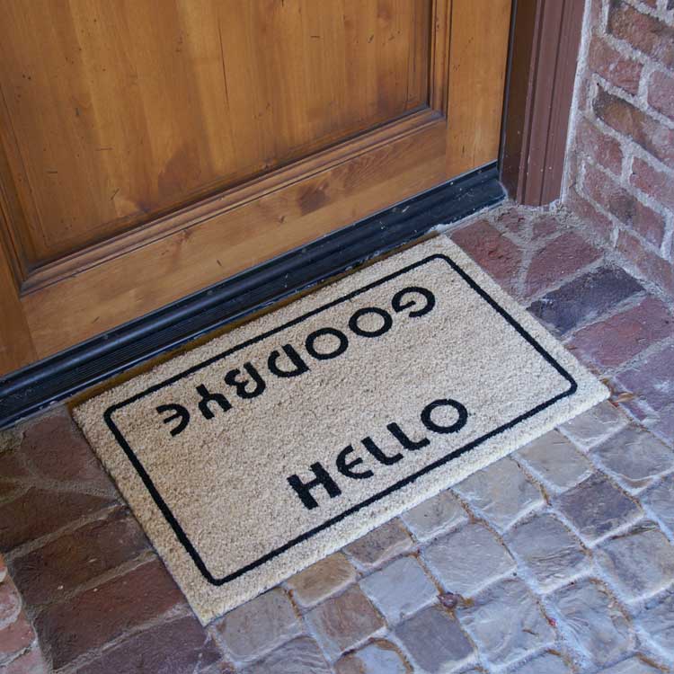 Hello, Welcome Goodbye Doormat Side Angle on Brick Entrance