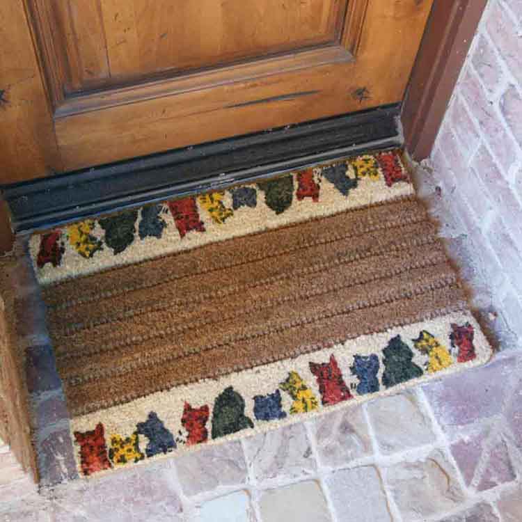 Kitty Cat Coir Decorative Door Mat Close Up on Brick Entrance