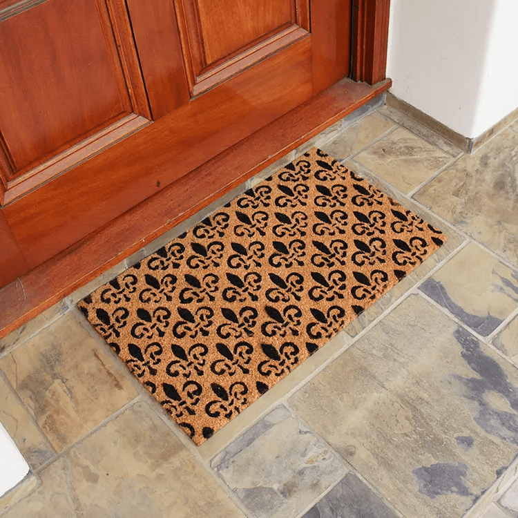 Side Top View of St Germaine Fleur De Lis Doormat In Front of Brown Front Door
