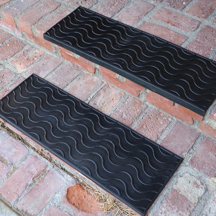 Black Waves Stair Treads on Outside Brick Stairs Black Waves Stair Treads on Outside Brick Stairs