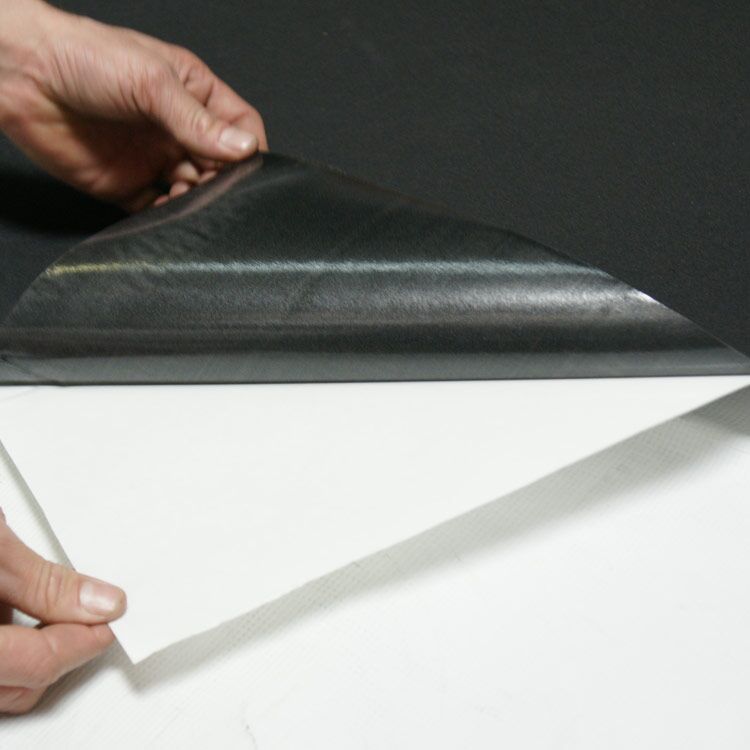 Person Applying Pressure Sensitive Adhesive on Closed Cell Blend Rubber Sheet Person Applying Pressure Sensitive Adhesive on Closed Cell Blend Rubber Sheet
