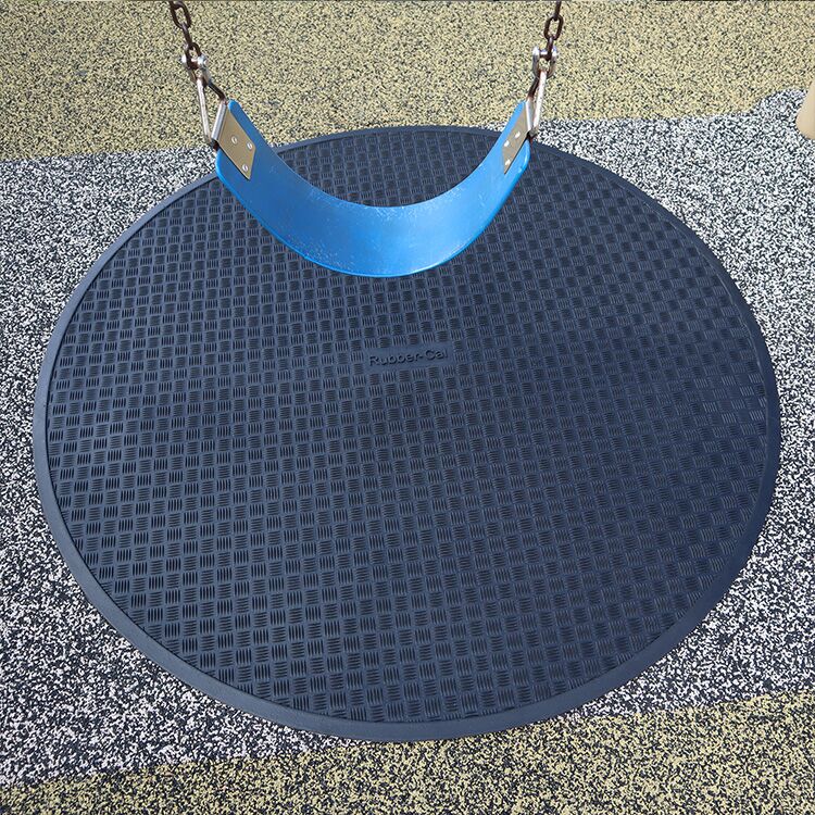 Black Circular Swing Set Mat Under a Blue Swing Black Circular Swing Set Mat Under a Blue Swing