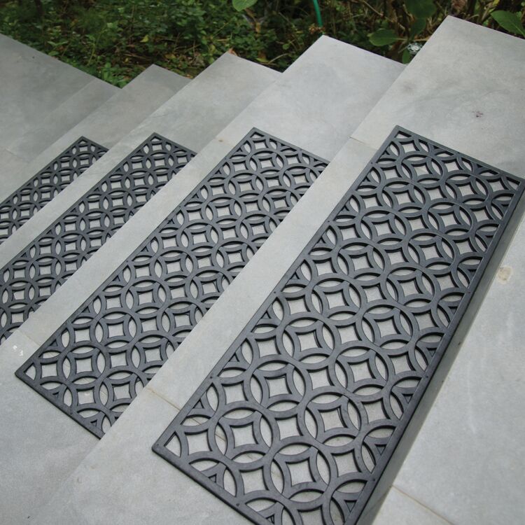 Azteca Pattern Black Rubber Stair Treads on Outdoor Gray Stone Steps Azteca Pattern Black Rubber Stair Treads on Outdoor Gray Stone Steps
